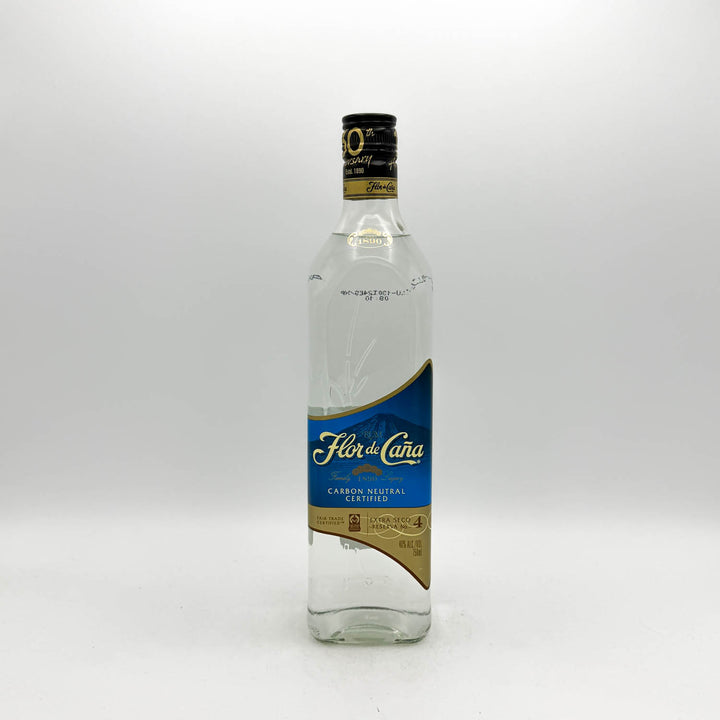 A bottle of Flor de la Cana Carbon Neutral Spirit de Alcohol 70% on a light gray background.