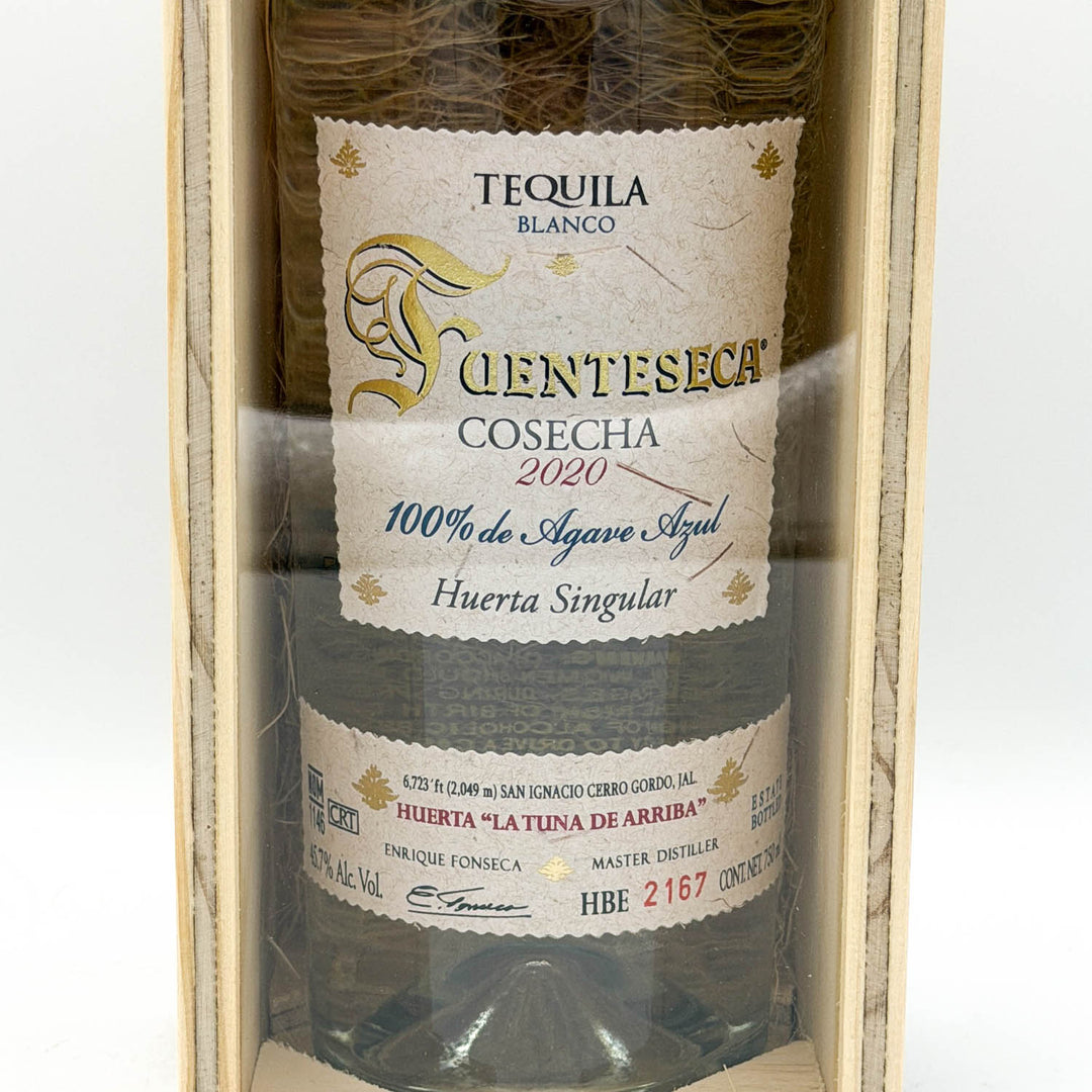 Tequila bottle with a label in a wooden box