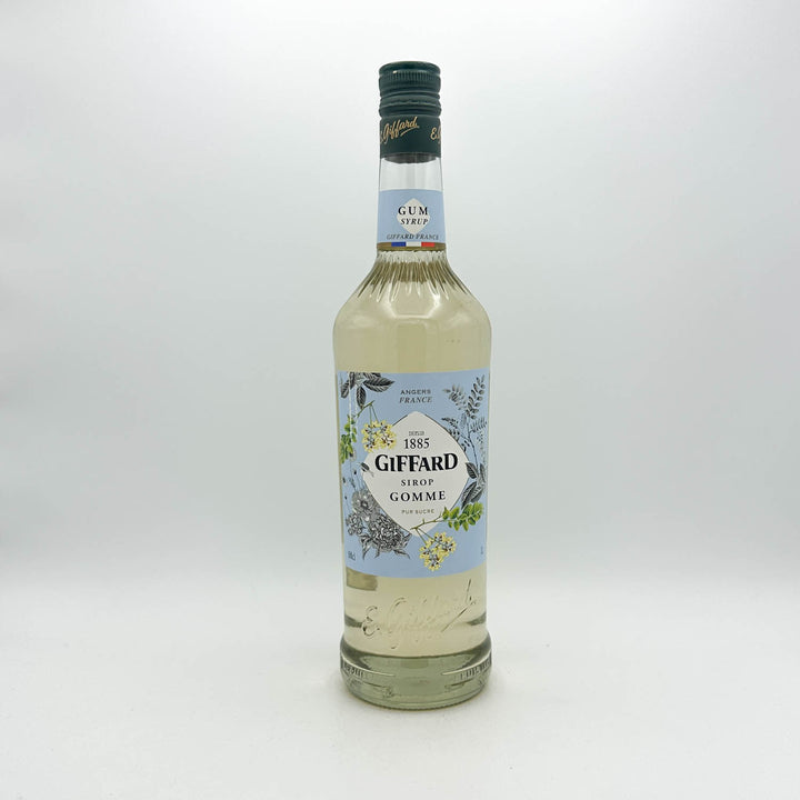 Bottle of Giffard gum syrup on a white background