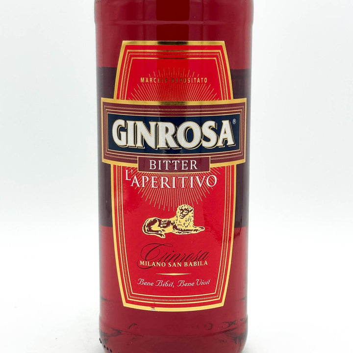 Bottle of Ginrosa Bitter L'aperitivo with a red label on a white background