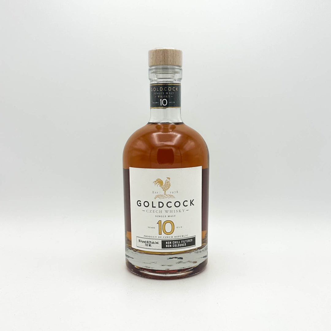 Bottle of Goldcock whisky on a white background