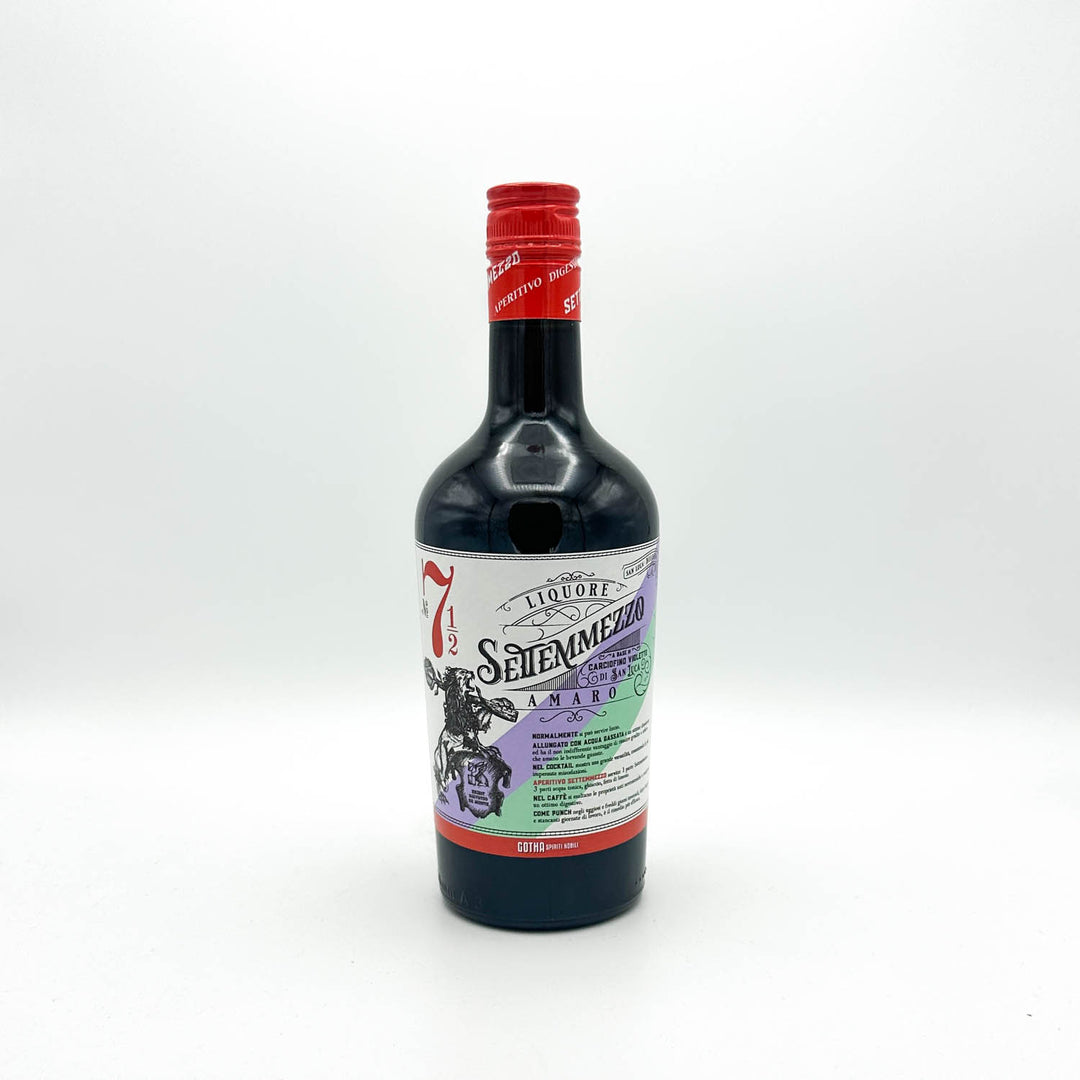 Bottle of Seileenmezito liqueur with a red cap on a white background