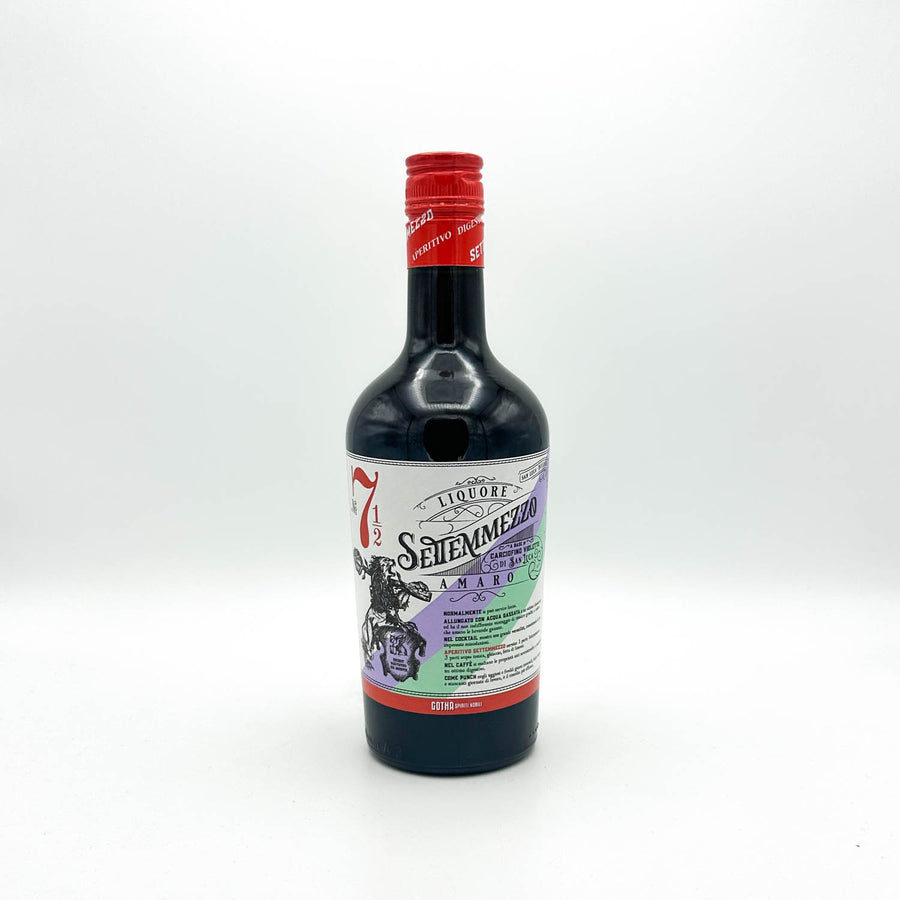 Bottle of Seileenmezito liqueur with a red cap on a white background