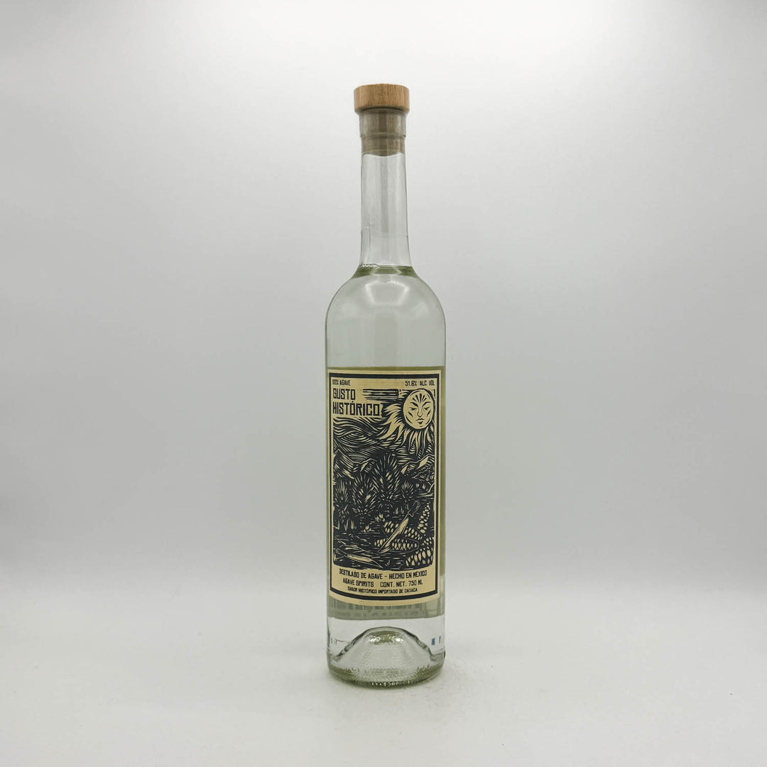 Clear glass bottle with a cork stopper on a white background
