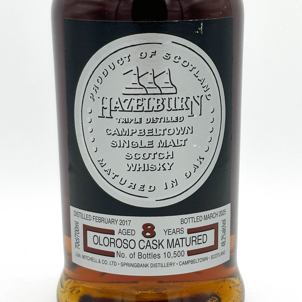 Hazelburn whisky bottle with label on a white background
