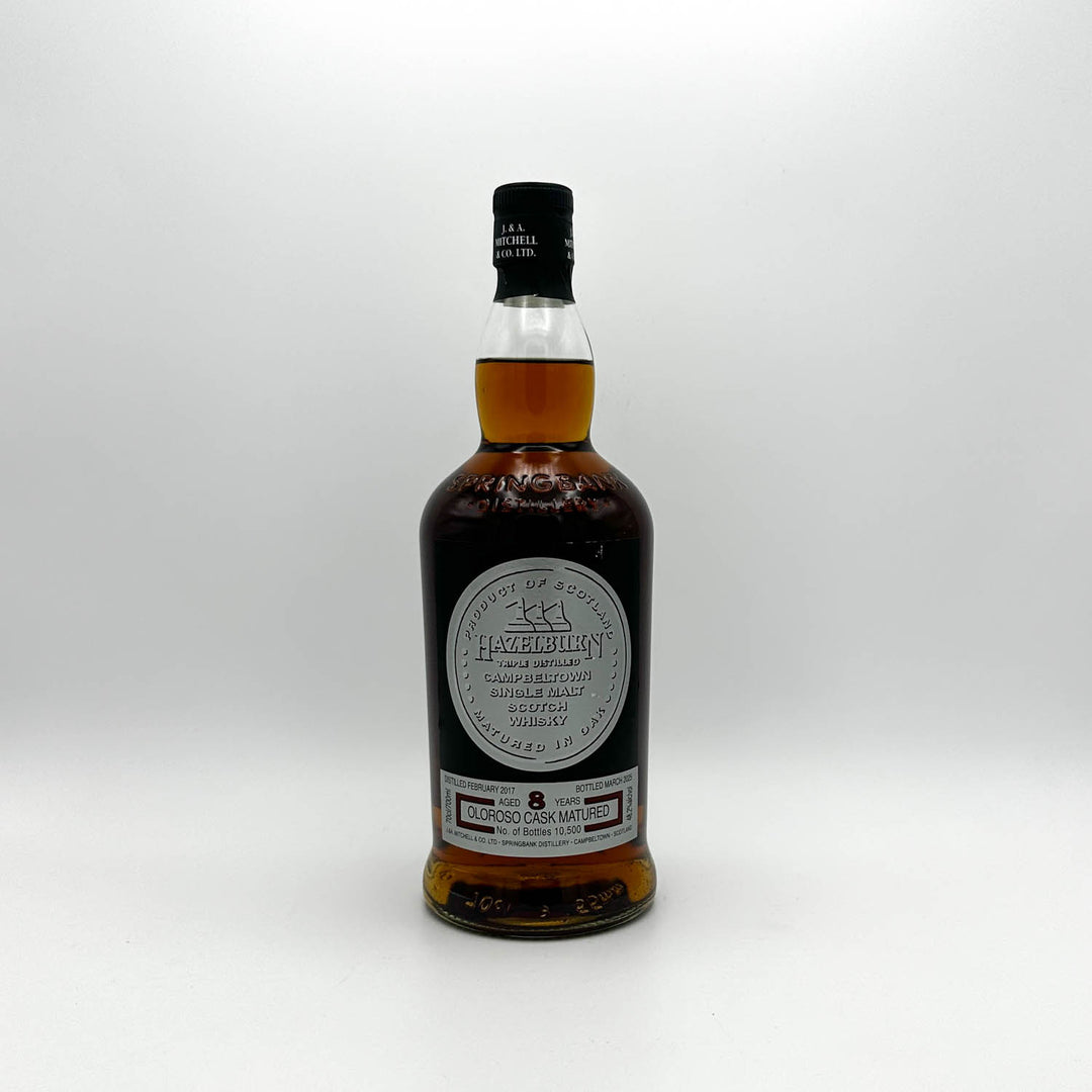 Whiskey bottle with a label on a white background