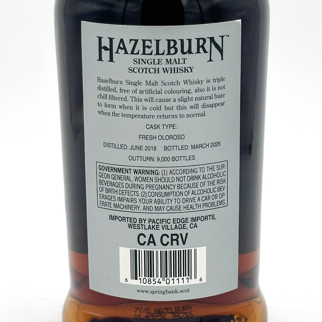 Close-up of the back label of a Hazelburn Single Malt Scotch Whisky bottle, showing product details, a barcode, and the CA CRV import code on a white background.