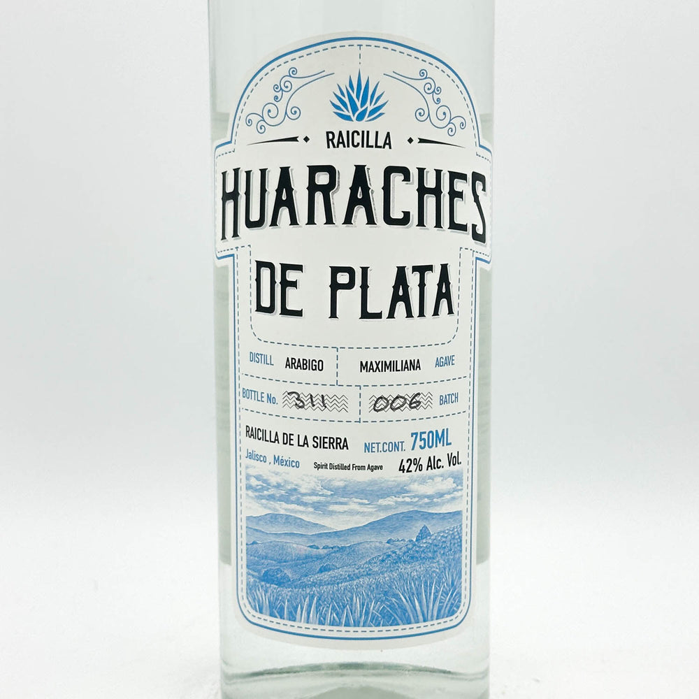 Huaraches de Plata Raicilla bottle with label on a white background