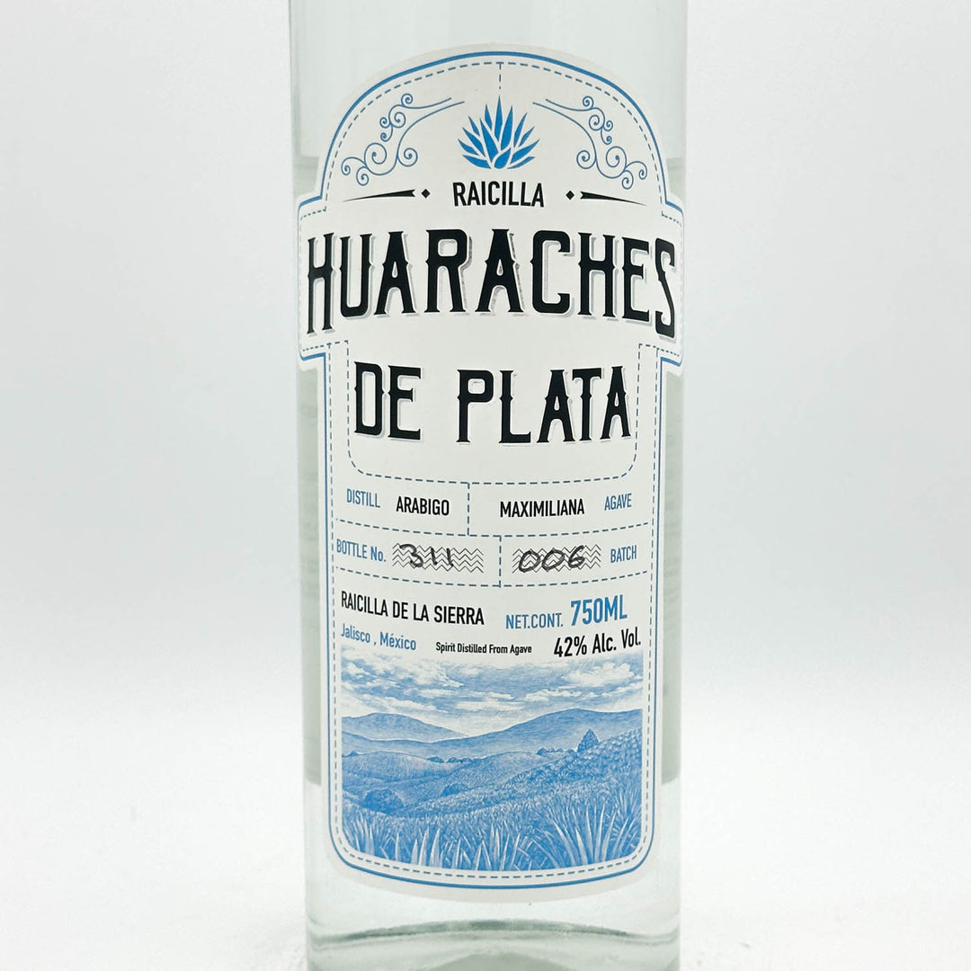 Huaraches de Plata Raicilla bottle with label on a white background
