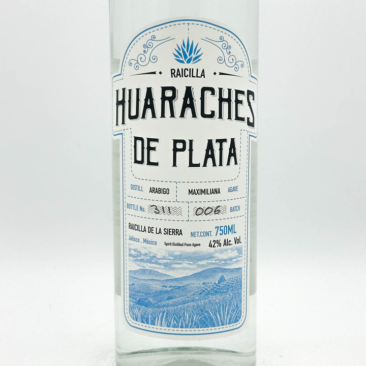 Huaraches de Plata Raicilla bottle with label on a white background