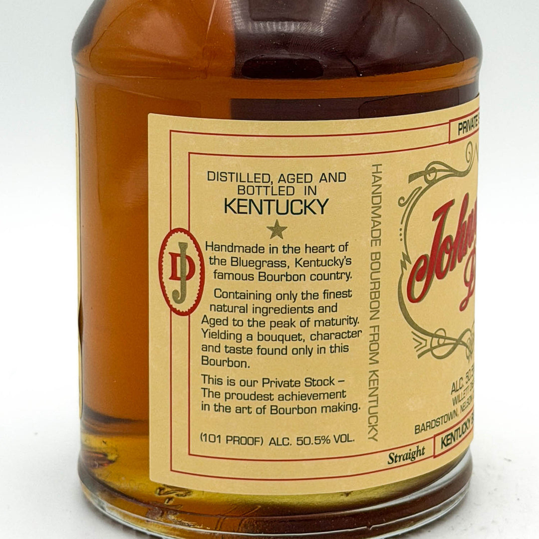 Bottle of Johnnie Walker whiskey with a label on a white background