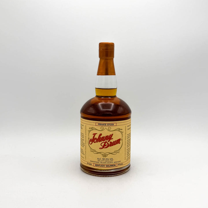 Bottle of Johnny Dram whiskey on a white background