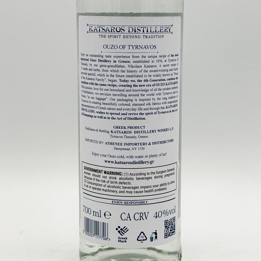 Back label of a Katsaros Distillery ouzo bottle on a white background