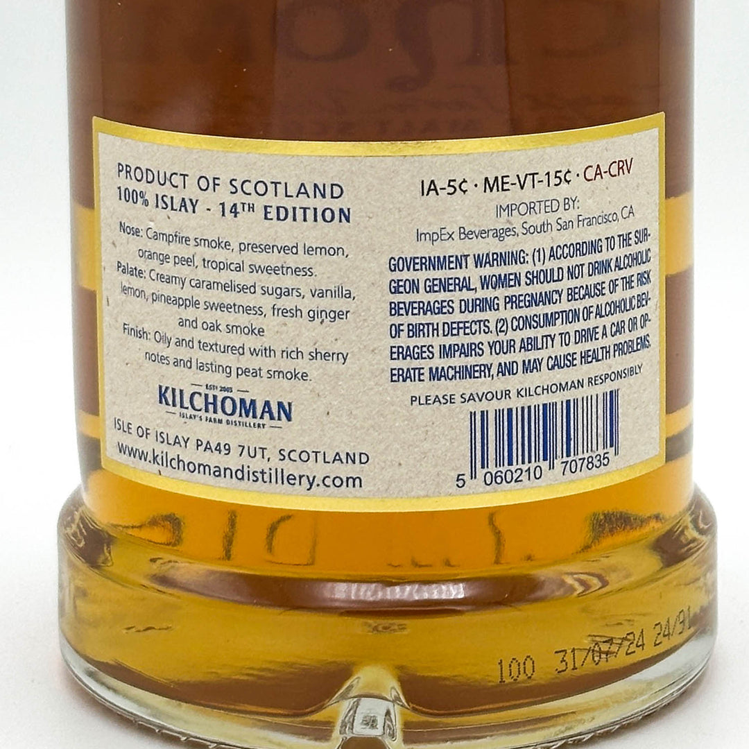Bottle of Kilchoman whisky with label showing product details and warning.