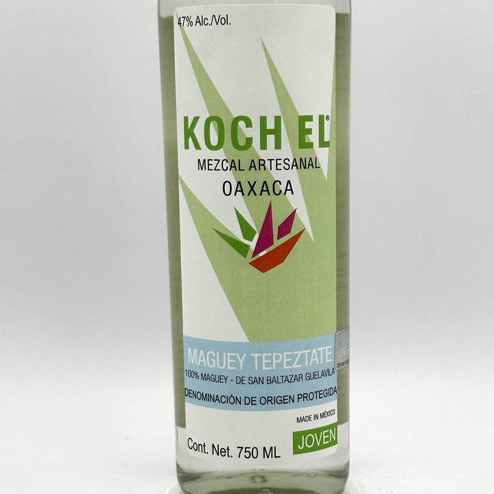 Bottle of Koch El Mezcal Artesanal Oaxaca with green label on a white background