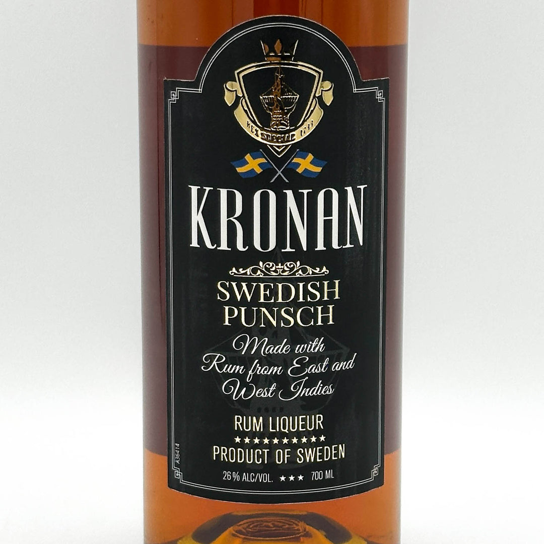 Bottle of Kronan Swedish Punsch with a black label on a white background