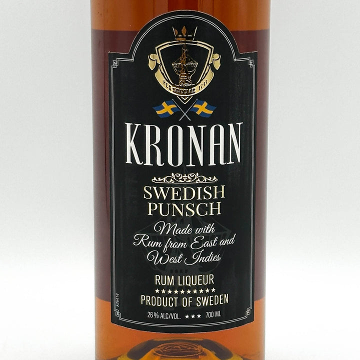 Bottle of Kronan Swedish Punsch with a black label on a white background