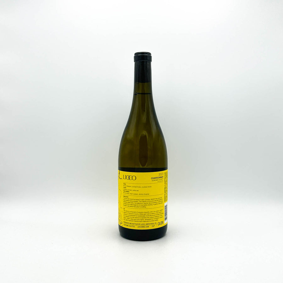 Wine bottle with yellow label on a white background