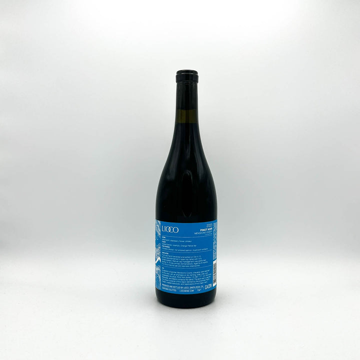Wine bottle with a blue label on a white background