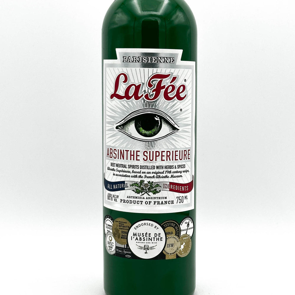 Green bottle of La Fée Absinthe Superieure with label on a white background
