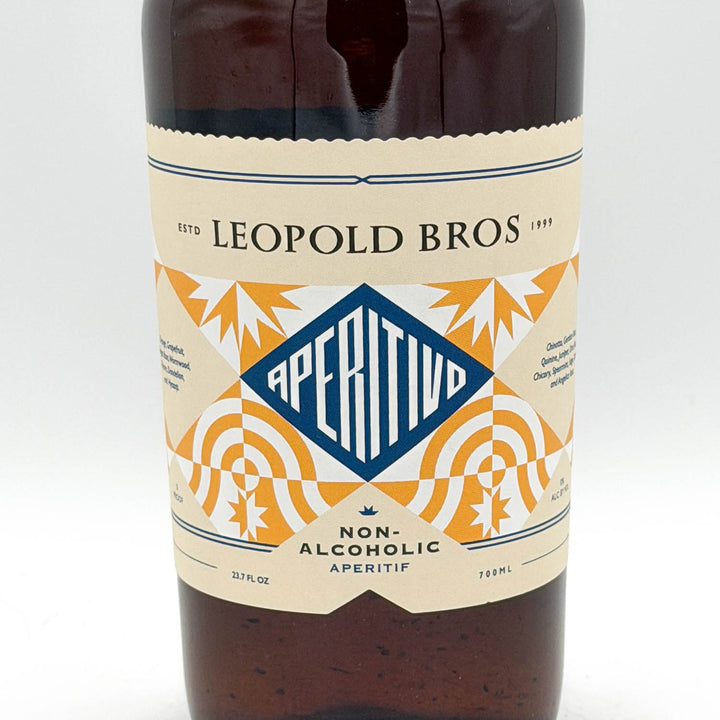 Bottle of Leopold Bros Aperitivo non-alcoholic aperitif with decorative label on a white background