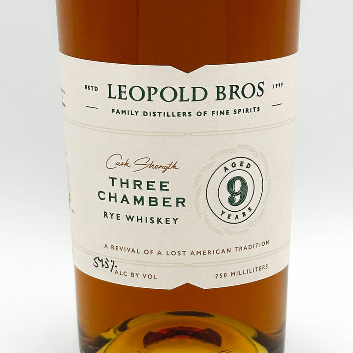 Leopold Bros Three Chamber Rye Whiskey bottle with label on a white background