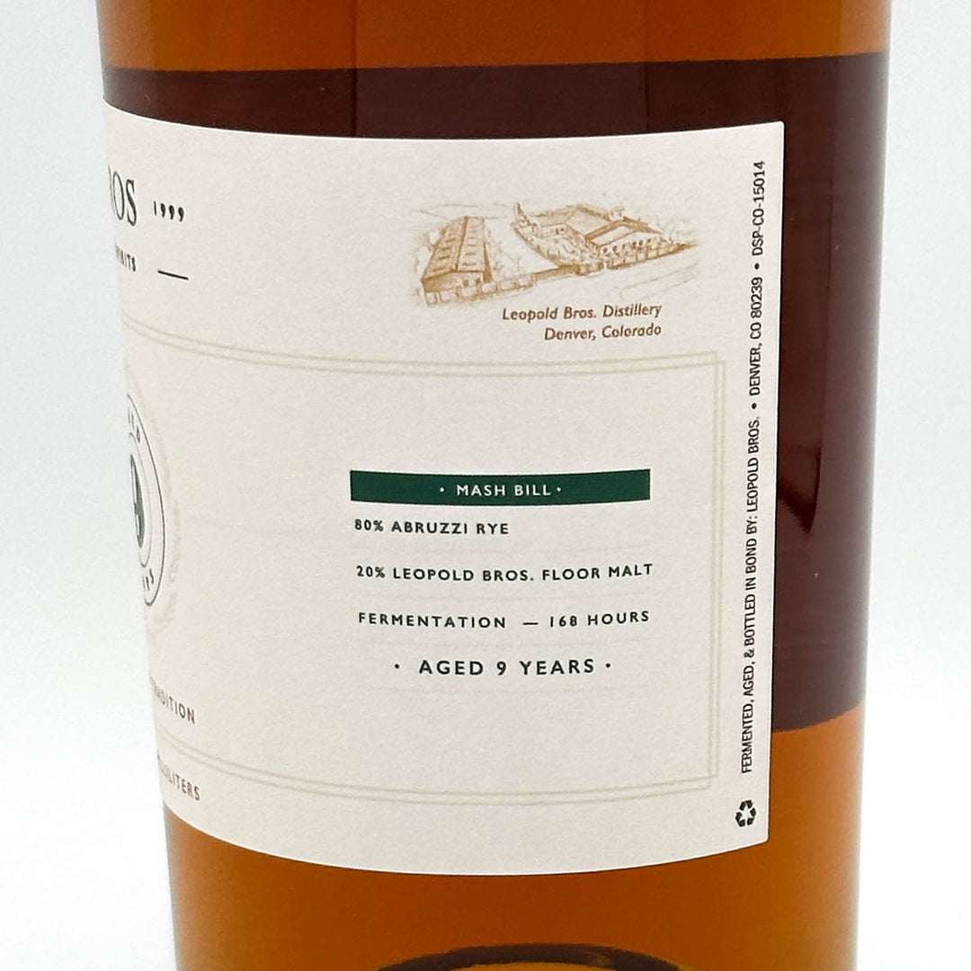 Bottle label of a whiskey with text and branding details.
