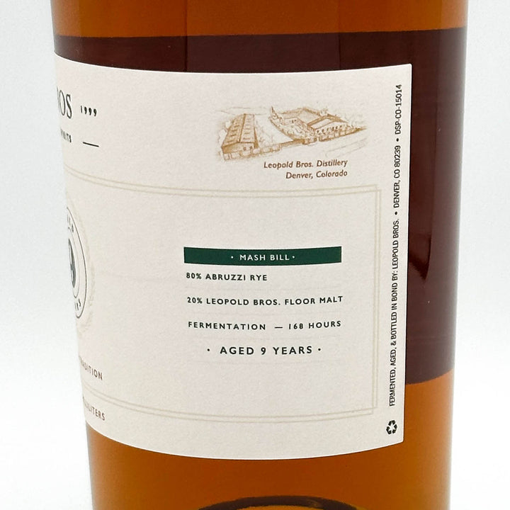 Bottle label of a whiskey with text and branding details.
