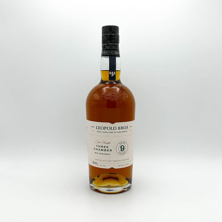 Bottle of Leopold Bros whiskey on a white background