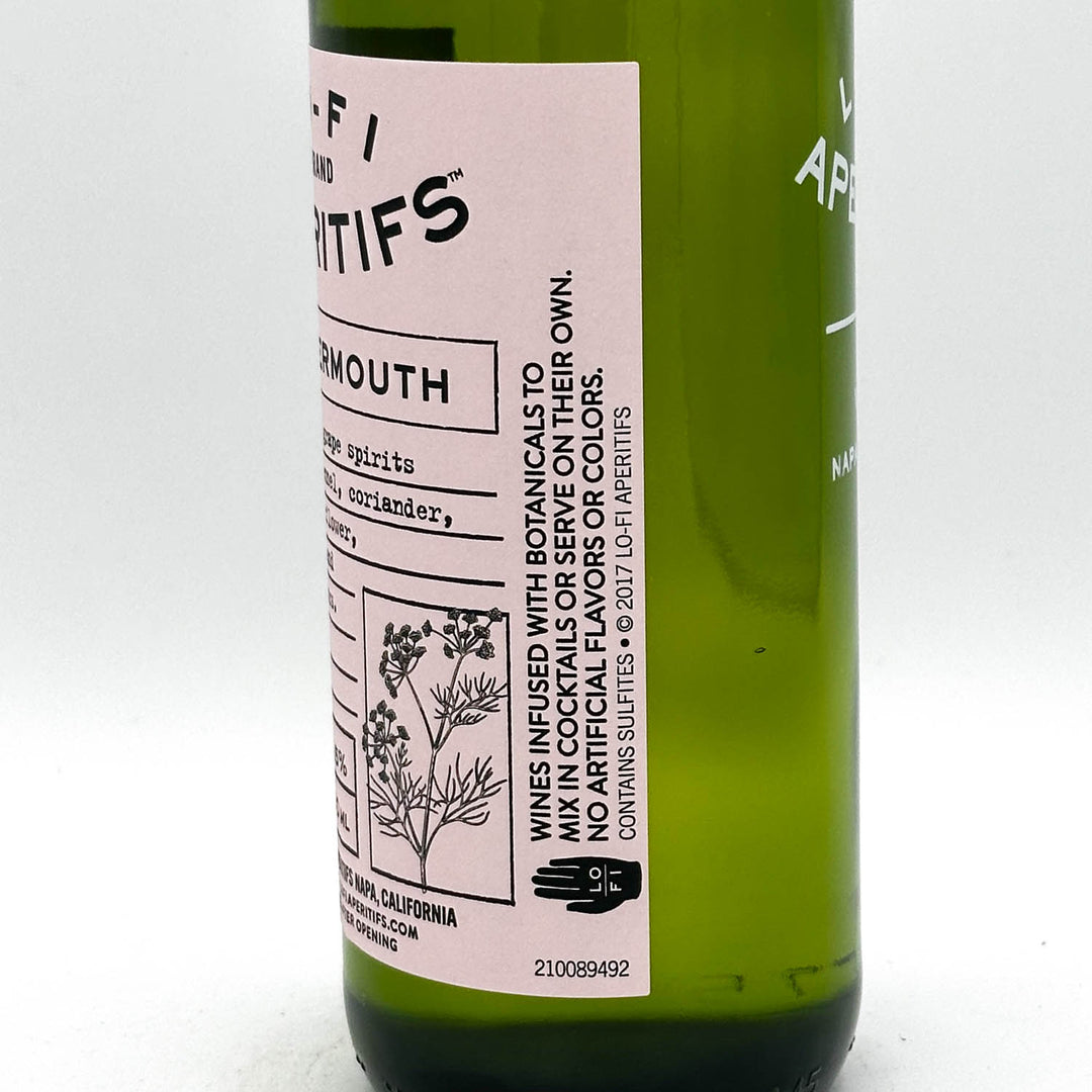 Green bottle with a pink label on a white background