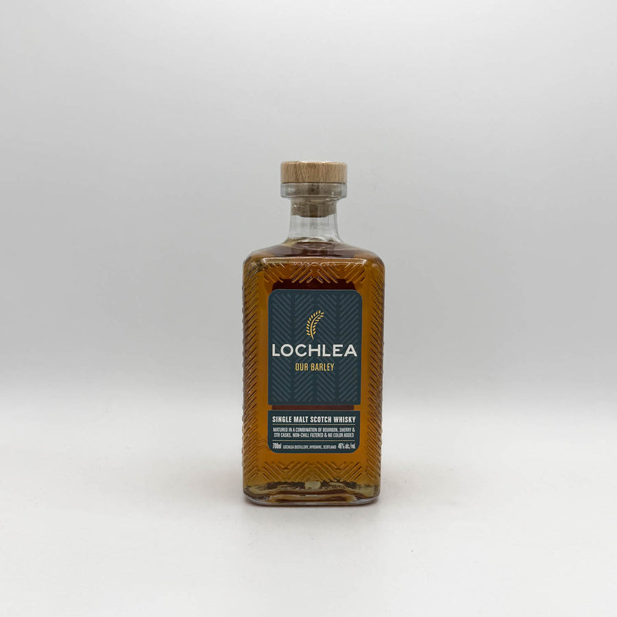 Bottle of Lochlea single malt Scotch whisky on a white background