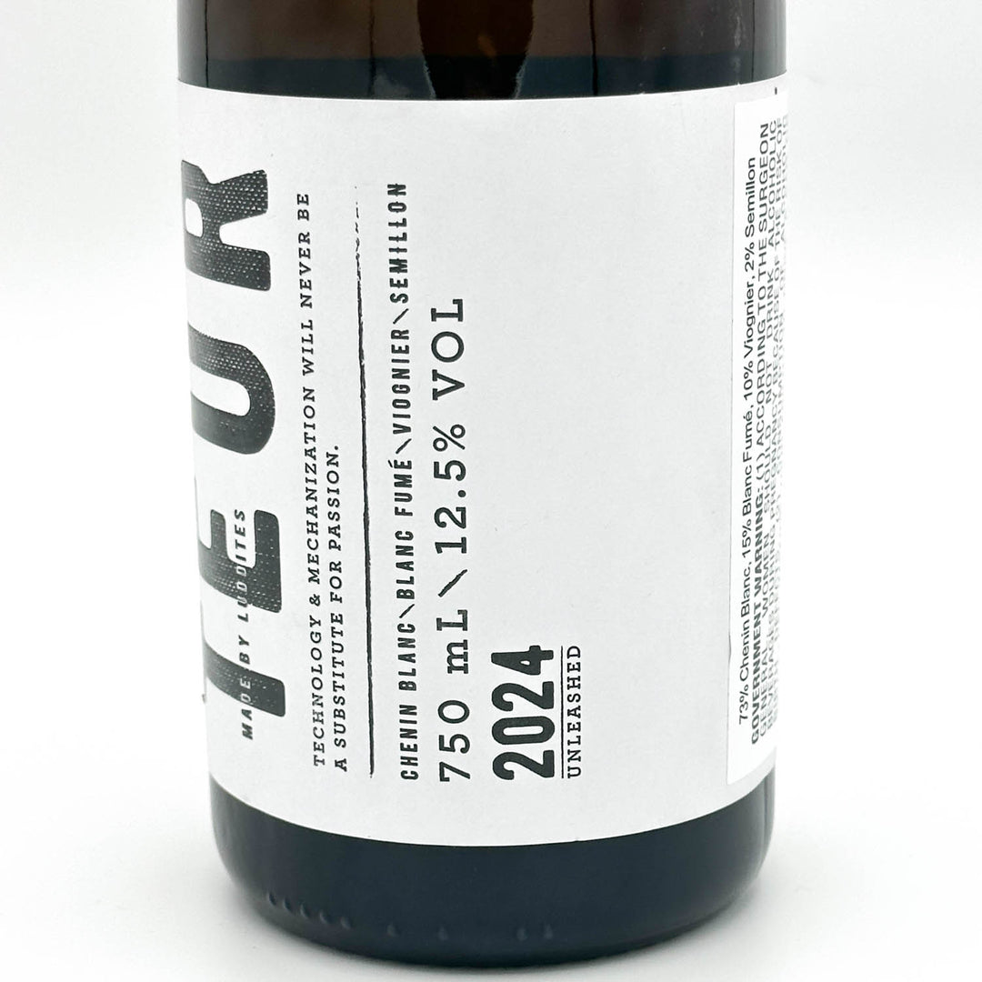 Close-up of a dark glass wine bottle with a white label featuring black text. The label reads 'TEUR' vertically, 'CHEVNN BLANC FUMÉ', '750 mL × 12.