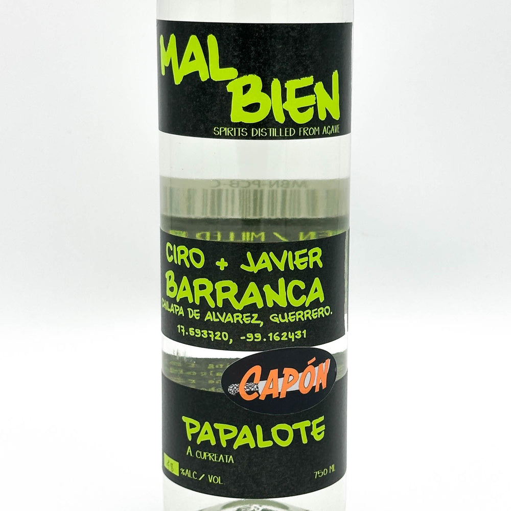 A clear bottle of Mal Bien Ciro + Javier Barranca Capón Papalote spirit distilled from agave, featuring black labels with bright green and orange text.