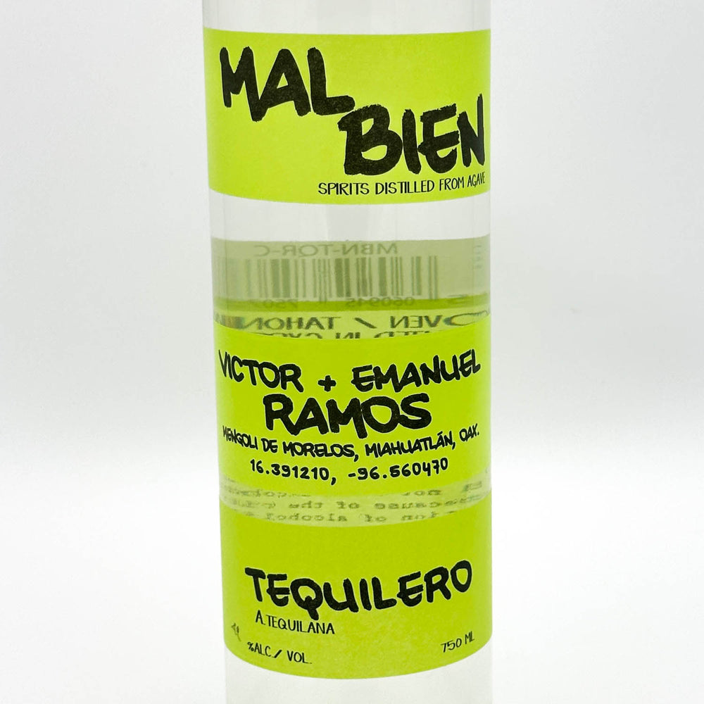 A clear bottle of tequilero spirit distillado with a bright lime green label. The label features black text reading 'MAL BIEN' at the top, 'VICTOR + EMANUEL RAMOS' in the middle, and 'TEQUILERO A TOGALANA' at the bottom.