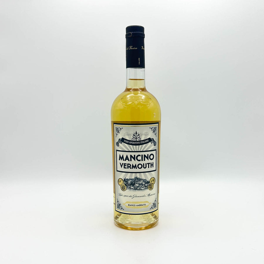 A bottle of Mancino Vermouth white vermouth wine with a cream and blue label, set against a plain white background.