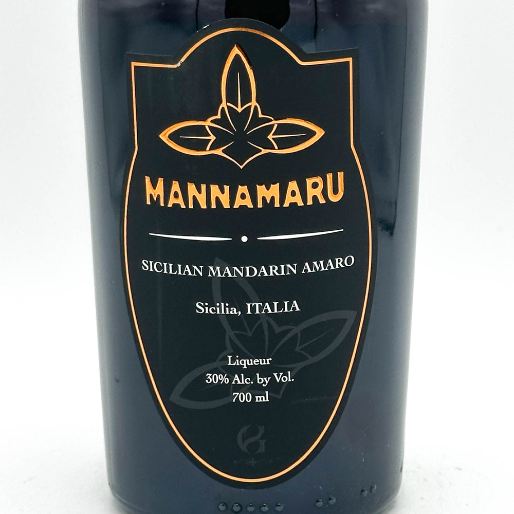 Bottle of Mannamaru Sicilian Mandarin Amaro with a black label on a white background