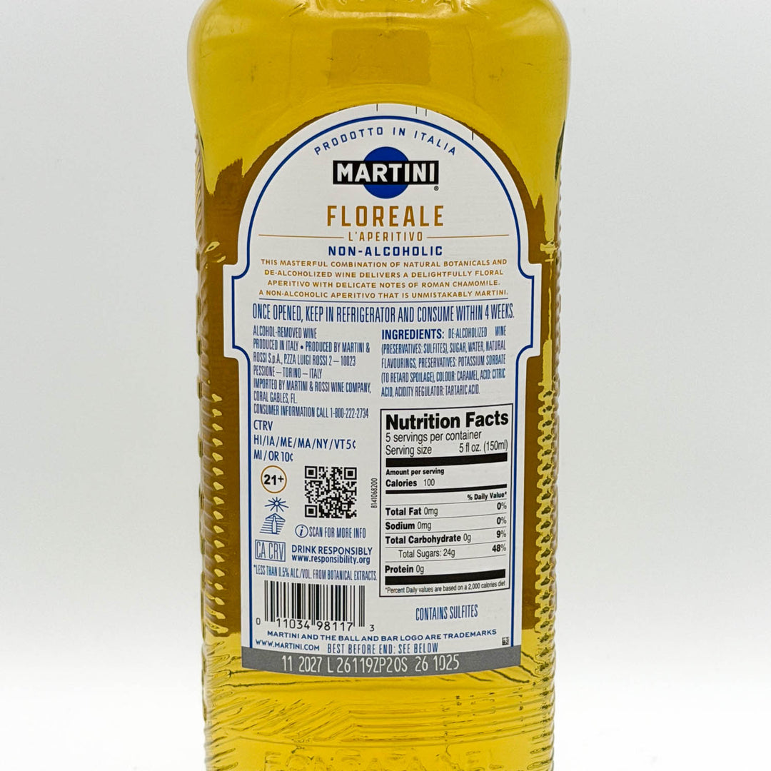 Back view of a Martini Floreale Non-Alcoholic liqueur bottle, showing the yellow liquid inside and the detailed white and blue product label.