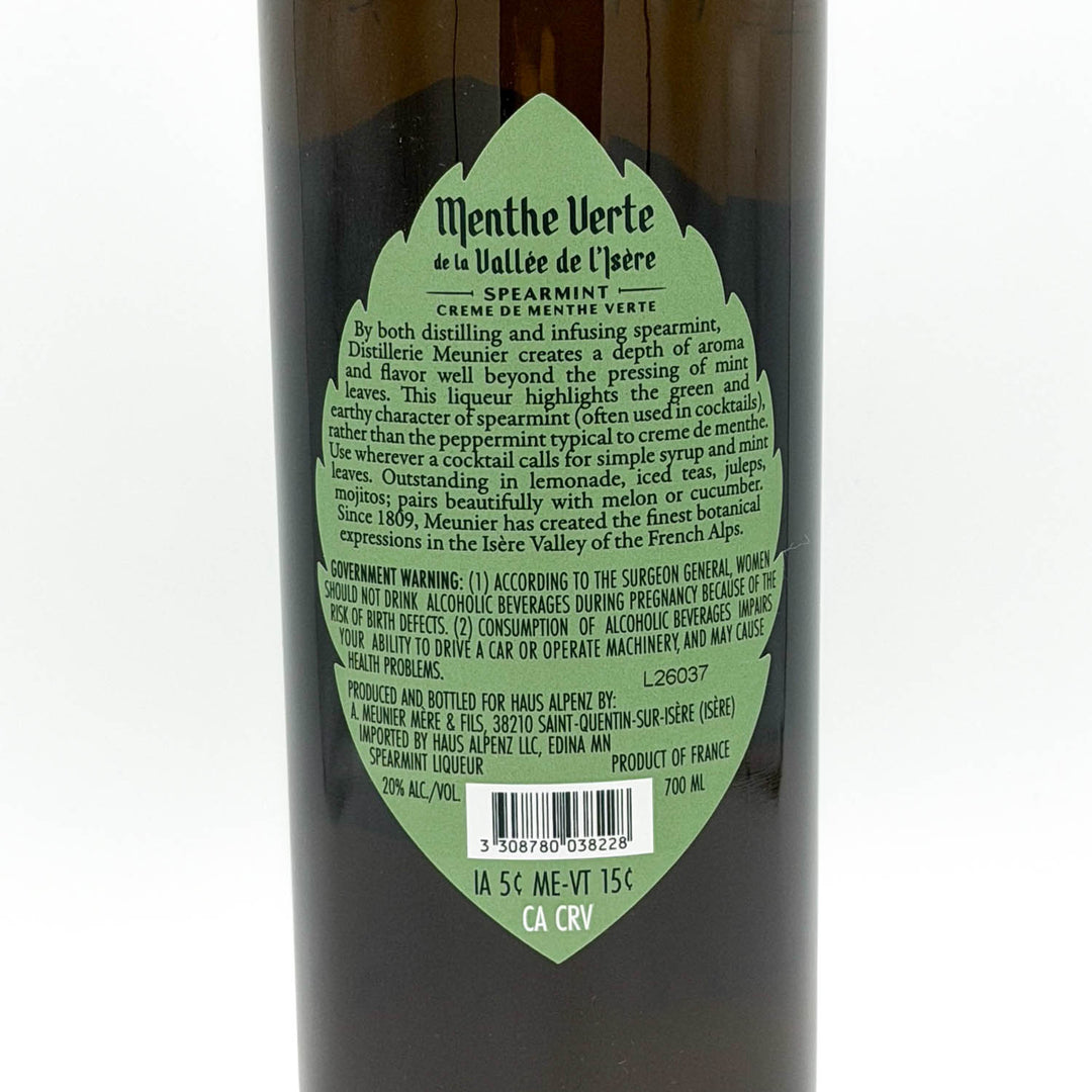 Bottle of Menthe Verte de la Vallee de l'Isere with green label on a white background
