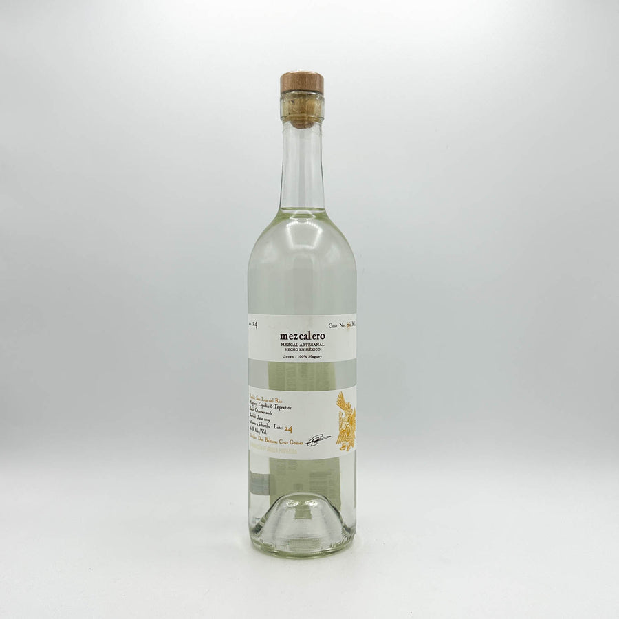 Clear bottle with cork stopper on a white background