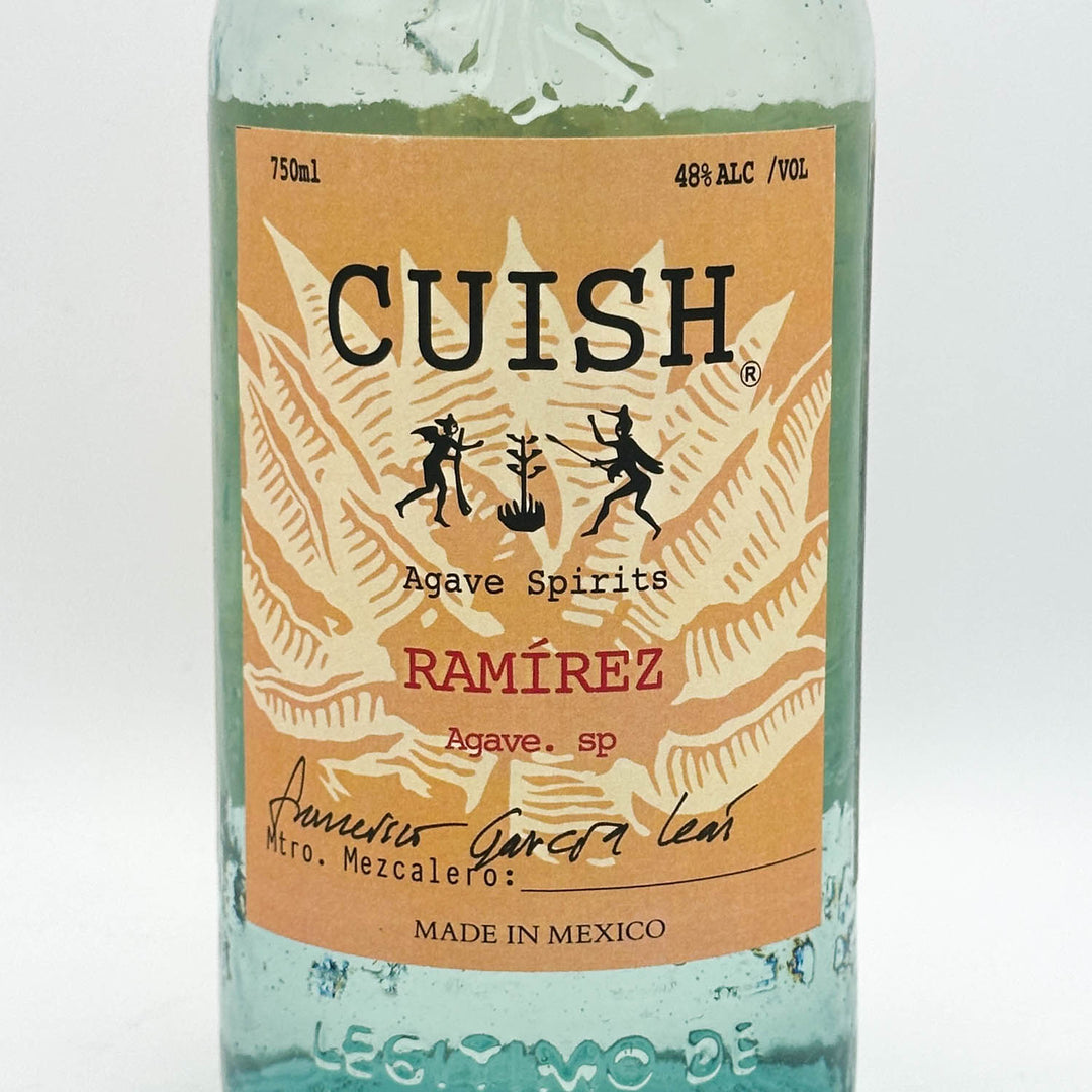 Bottle of Cuish Agave Spirits with a decorative label on a white background
