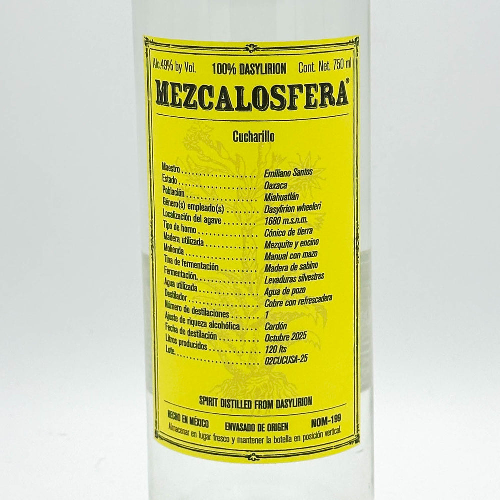 A bottle of Mezcalosfera 100% Basylion Cucharillo spirit distill from Dorym, featuring a bright yellow label with black text on a white bottle.