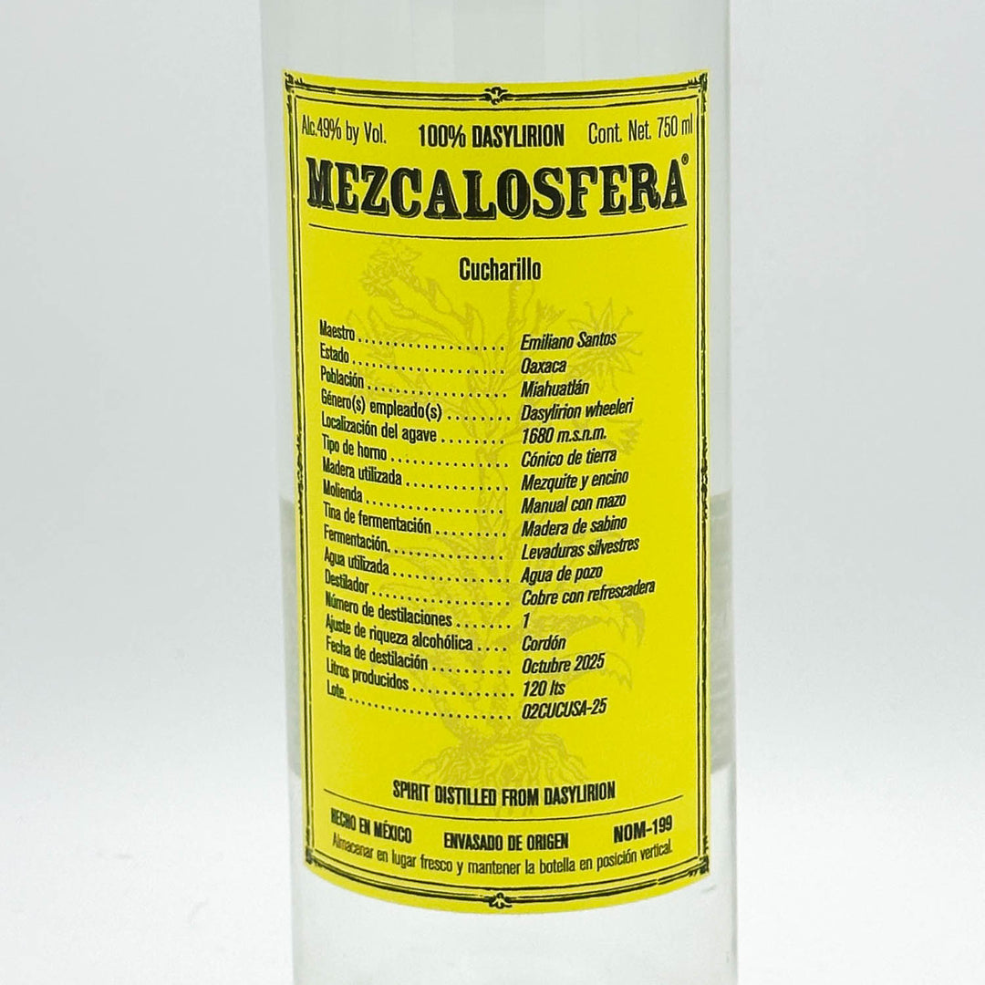 A bottle of Mezcalosfera 100% Basylion Cucharillo spirit distill from Dorym, featuring a bright yellow label with black text on a white bottle.