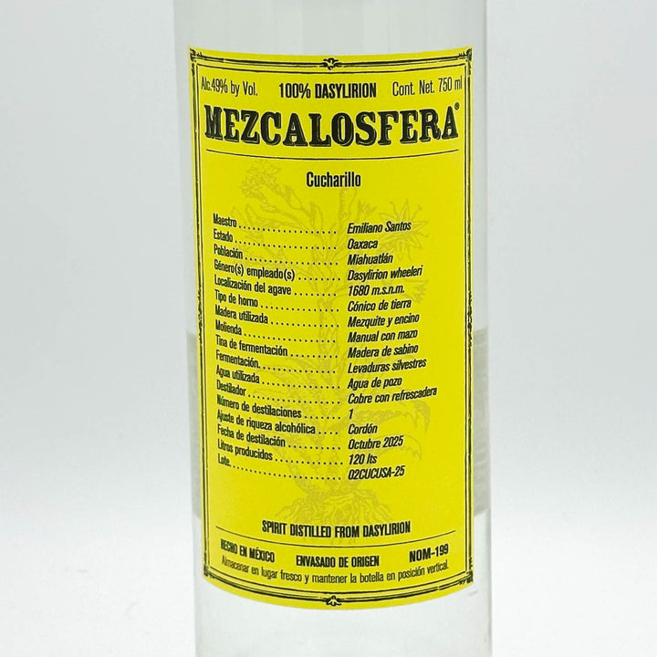 A bottle of Mezcalosfera 100% Basylion Cucharillo spirit distill from Dorym, featuring a bright yellow label with black text on a white bottle.