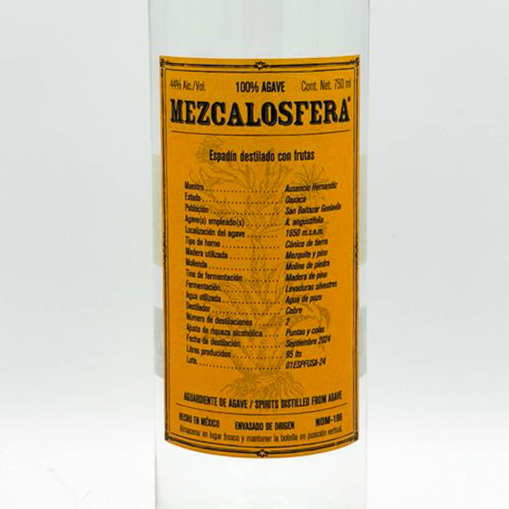 Bottle of Mezcalosfera with a yellow label on a white background