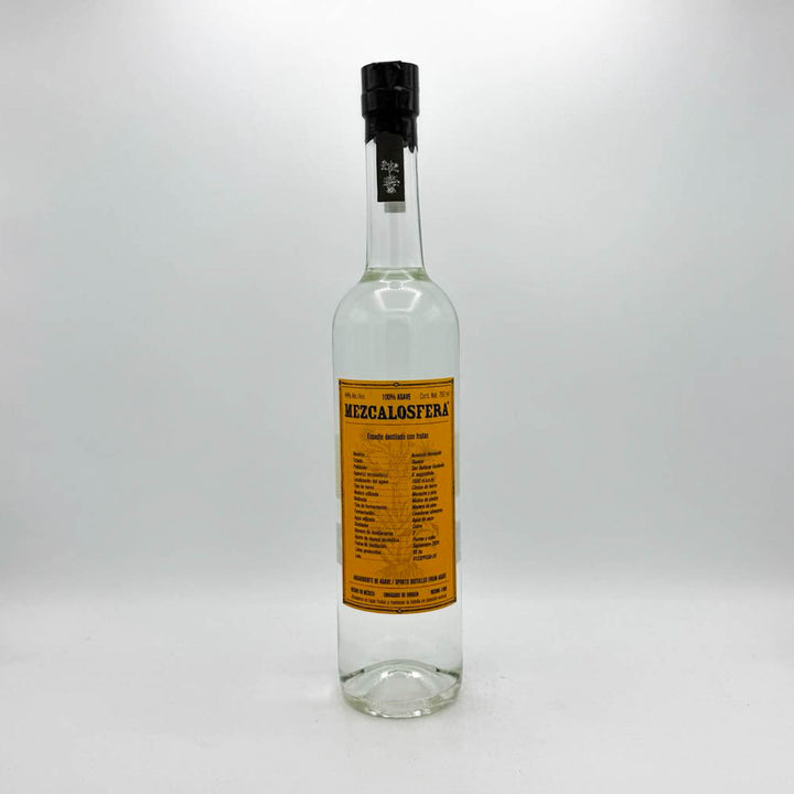 Clear bottle with a yellow label on a white background