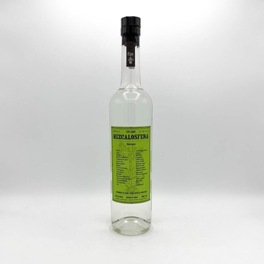 Bottle of Mezcal Oaxaca with a green label on a white background