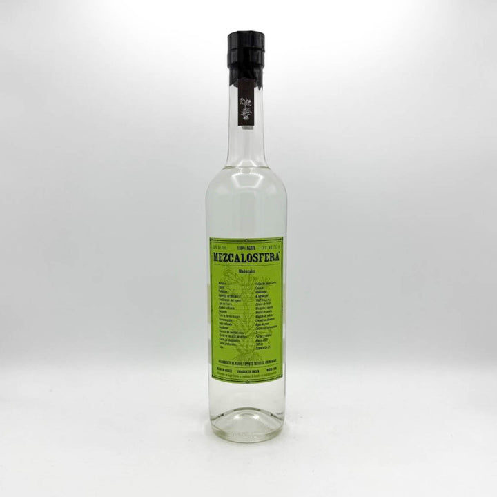 Bottle of Mezcal Oaxaca with a green label on a white background