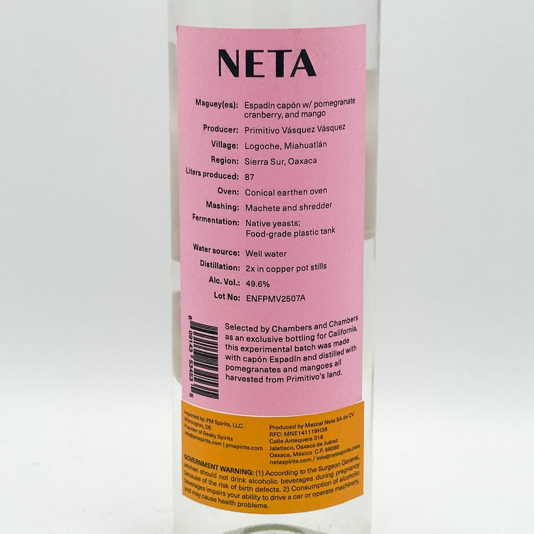 A bottle of Neta Agave Spirits with a pink and light green label, featuring a red circular sticker on the lower right, photographed against a plain white background.