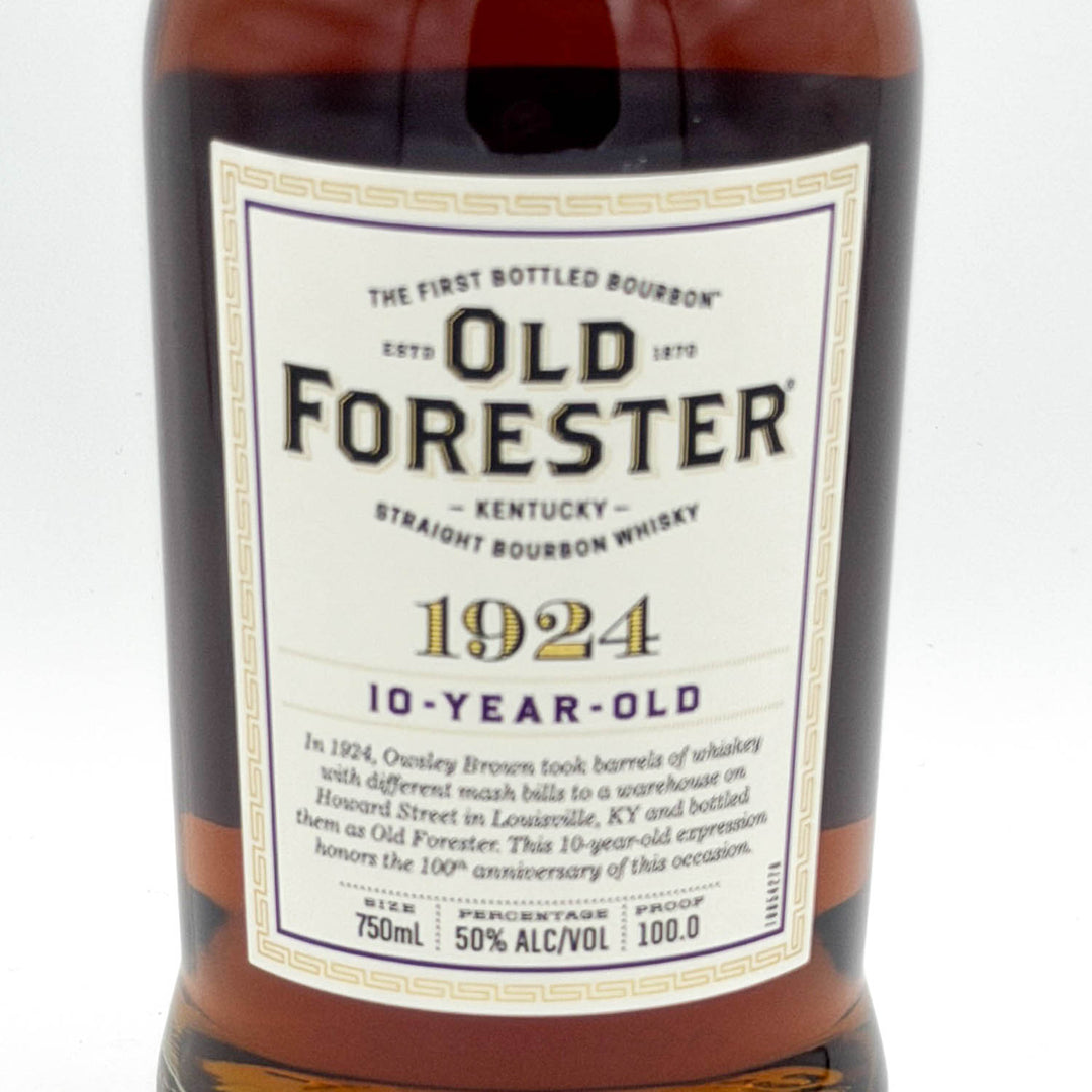 A close-up of an Old Forester 1924 10-year-old straight bourbon whiskey bottle, showing the amber liquid and the white label with black and gold text against a white background.