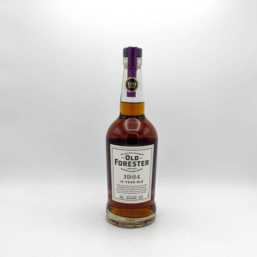 A bottle of Old Forester 1924 10 Year Old single malt Scotch whisky, featuring a white label and a purple foil neck seal, set against a plain light gray background.